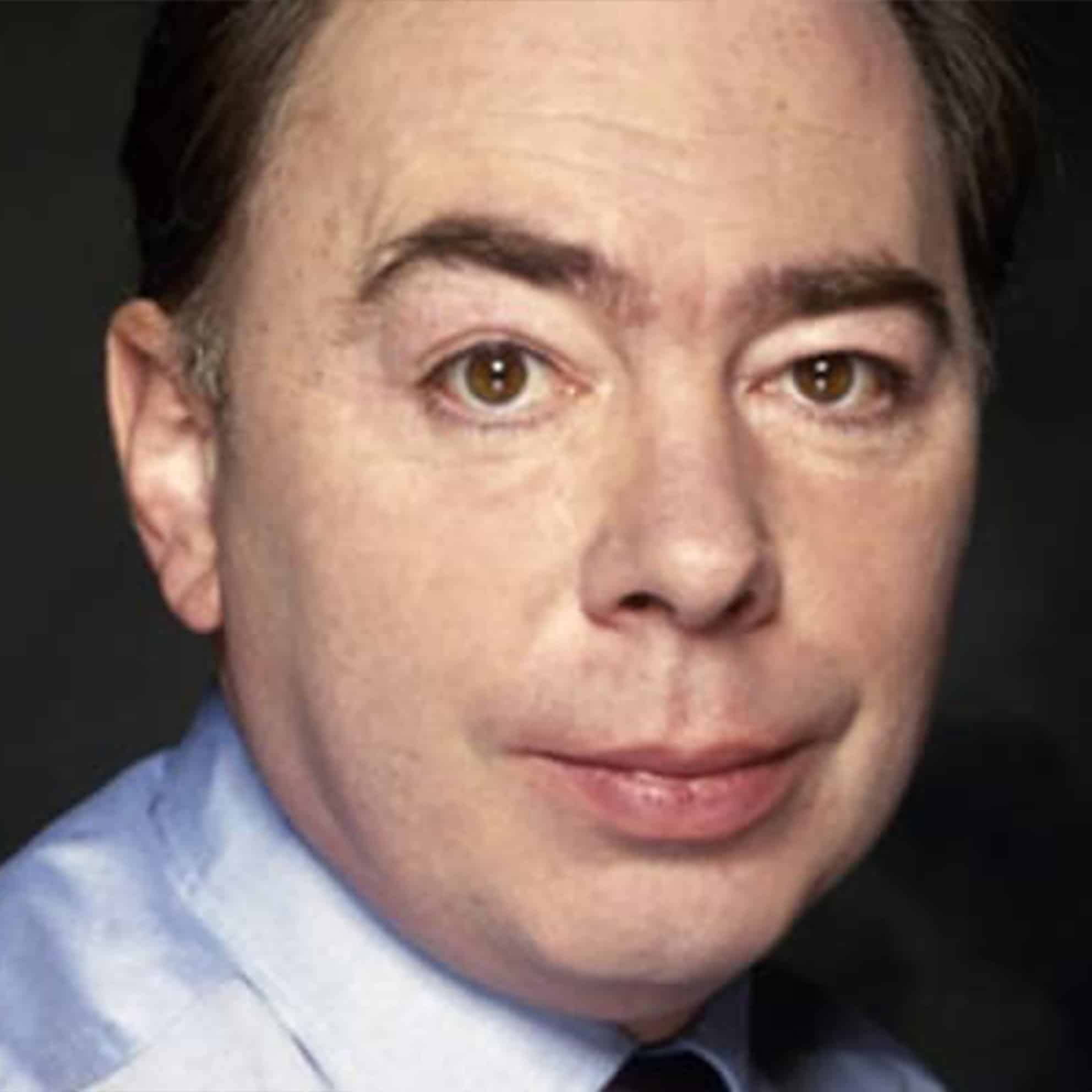 A person with short dark hair, wearing a light blue shirt, gazes forward against a dark background, embodying the focus and dedication of The Print 4 Team.