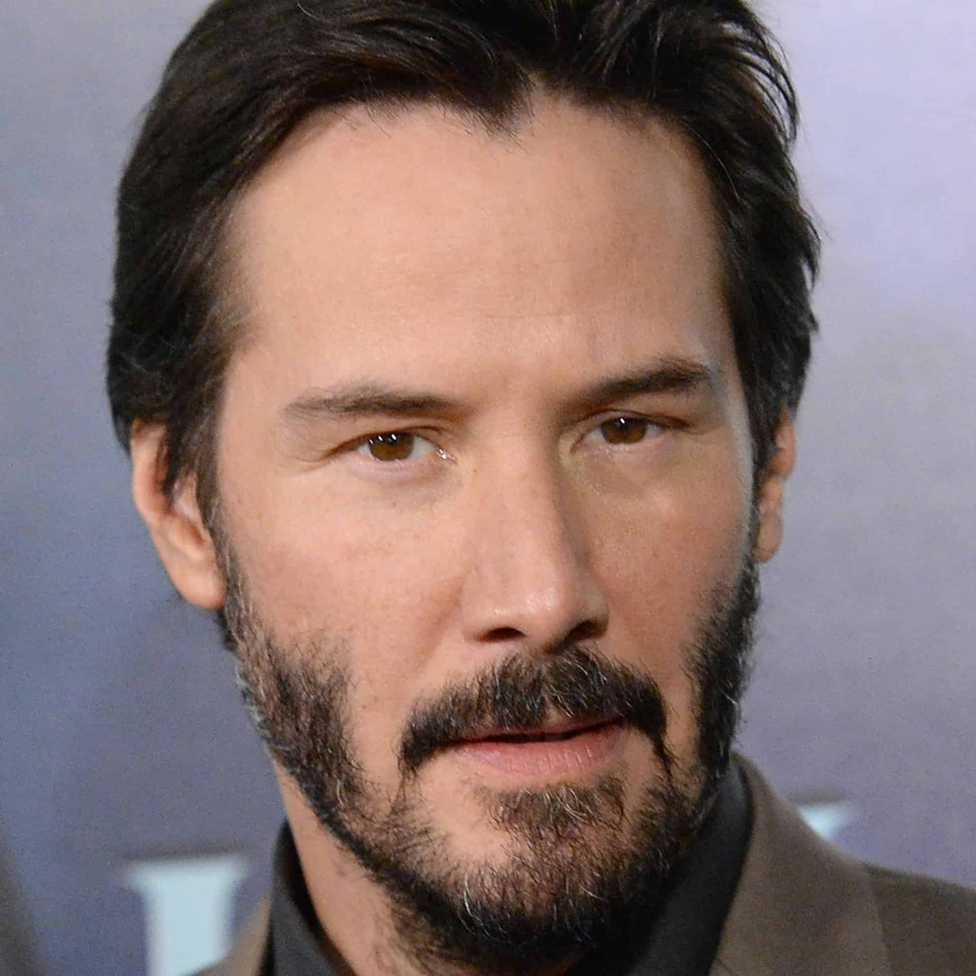 A man with dark hair and a beard, wearing a brown shirt, appears pensively on a neutral background, embodying the introspective spirit of The Print 4 Team.