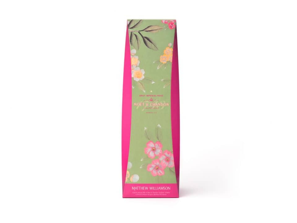 A tall, pink and green floral-patterned box elegantly displays Matthew Williamson's name alongside the iconic MOET logo.