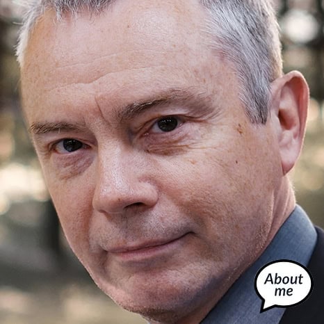 A man with gray hair, wearing a suit, stands confidently. A speech bubble near him says "About me," as he introduces himself as part of The Print 4 Team.